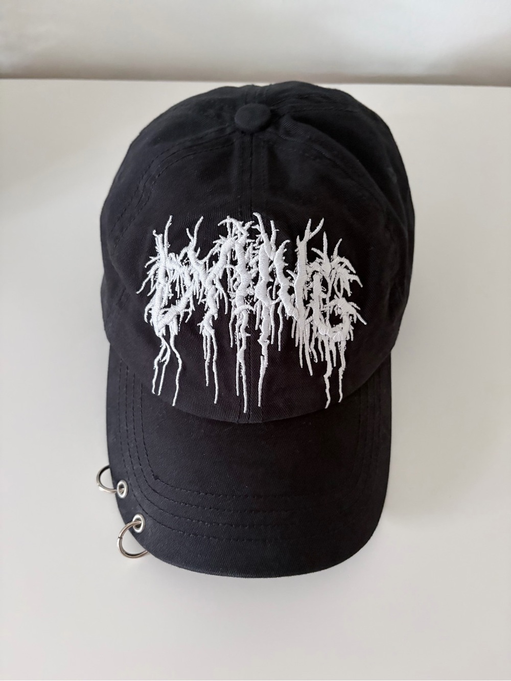 Dolls Kill pierced baseball cap